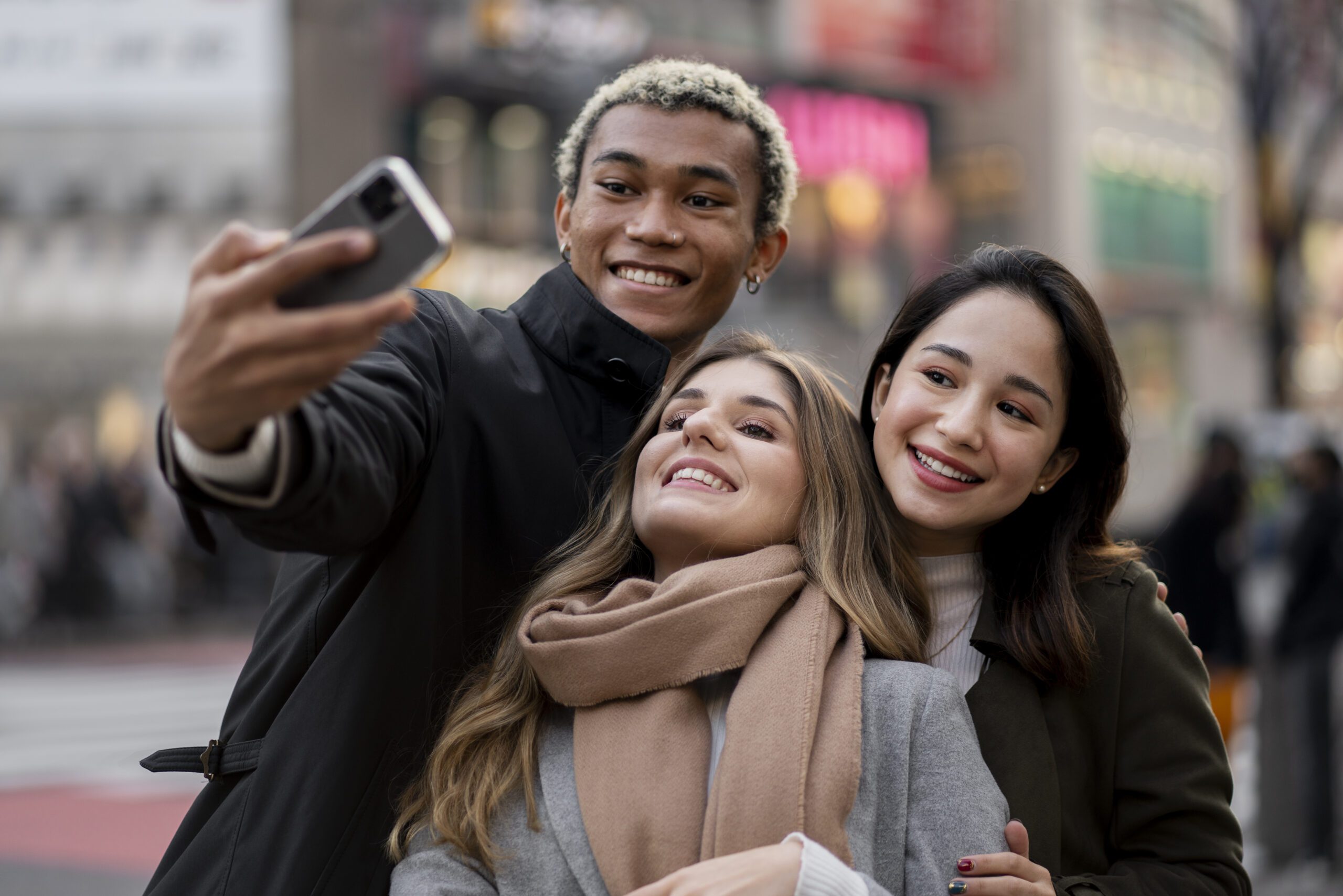 a group of people taking a selfie