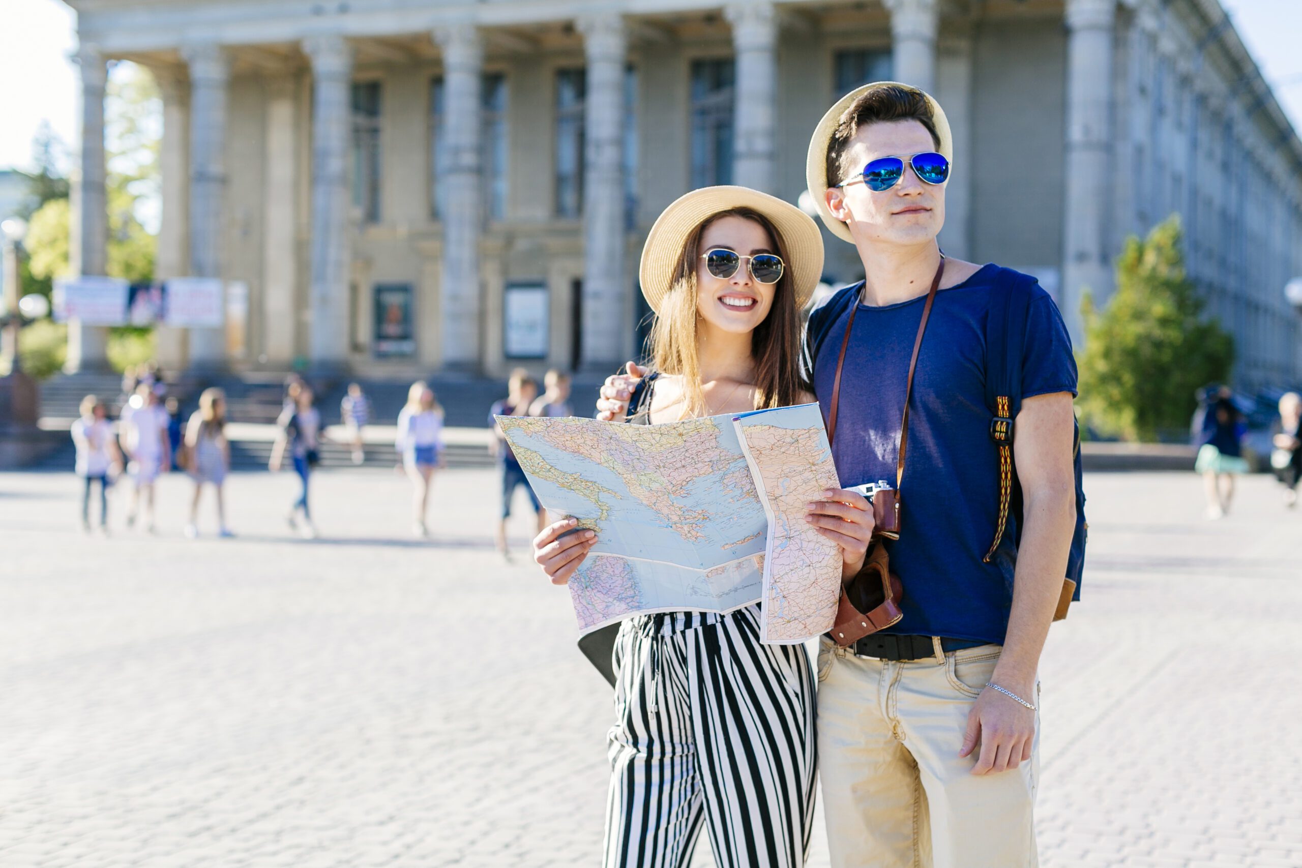 a man and woman holding a map